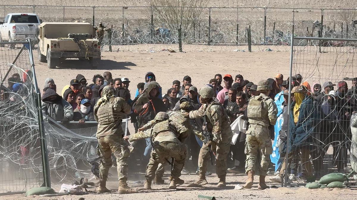 Migrants storm the gate at the border in El Paso