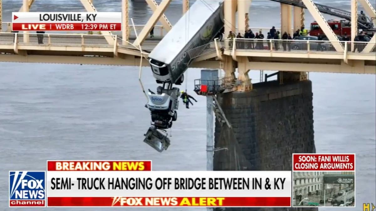 Driver dramatically rescued from semi-truck dangling over Louisville bridge  | Fox News