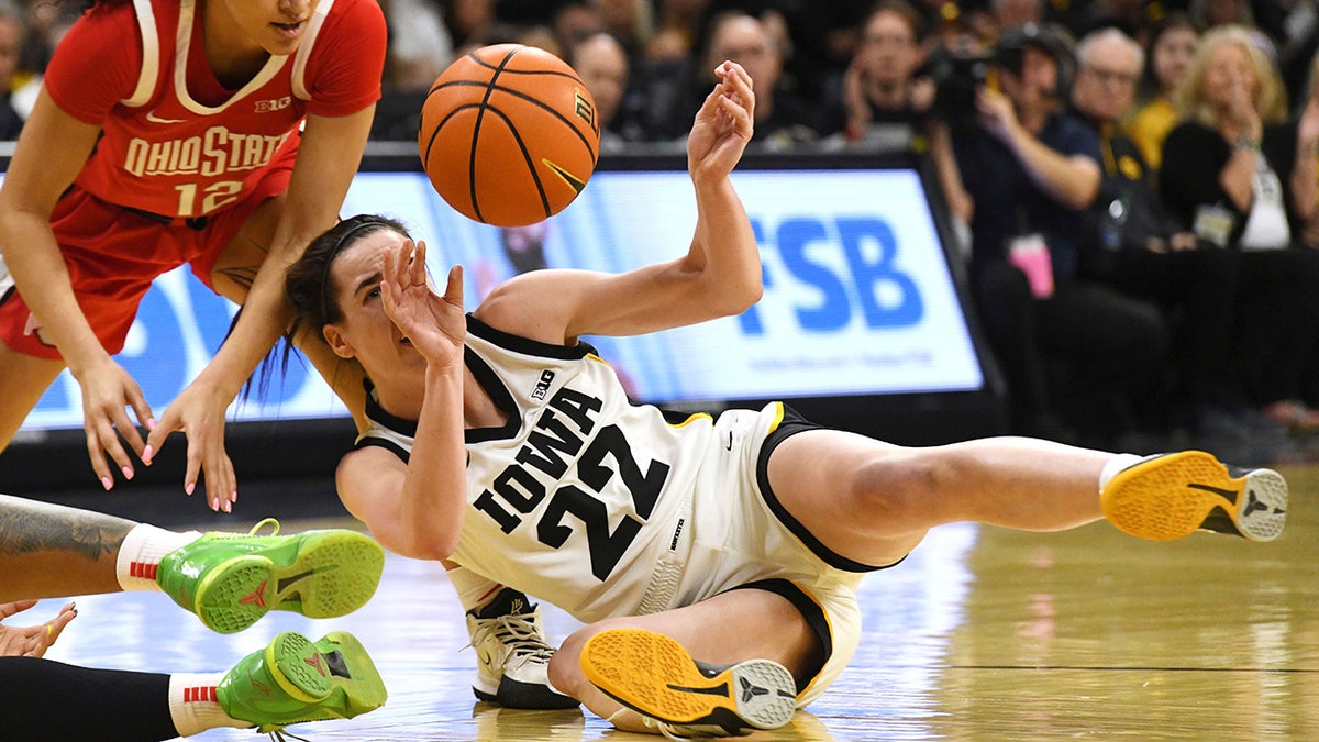 Caitlin Clark goes for the ball