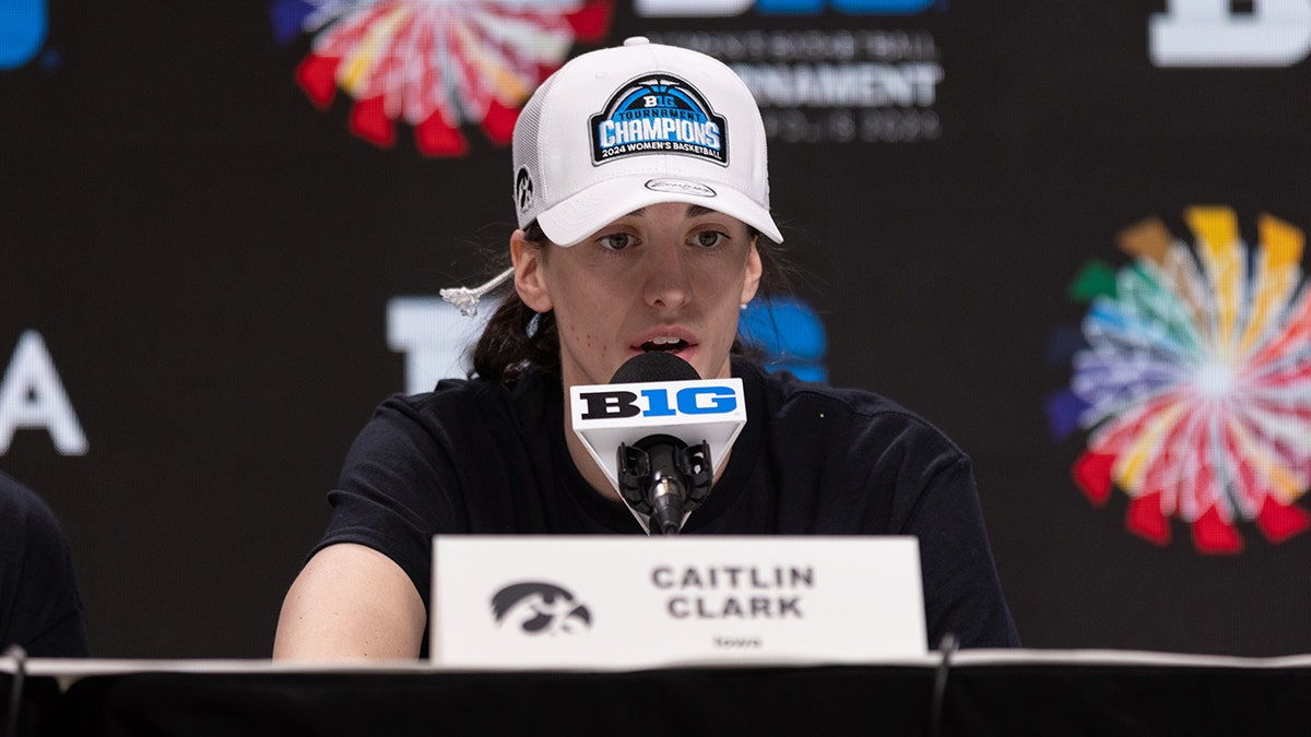 Iowa's Caitlin Clark talks to reporters