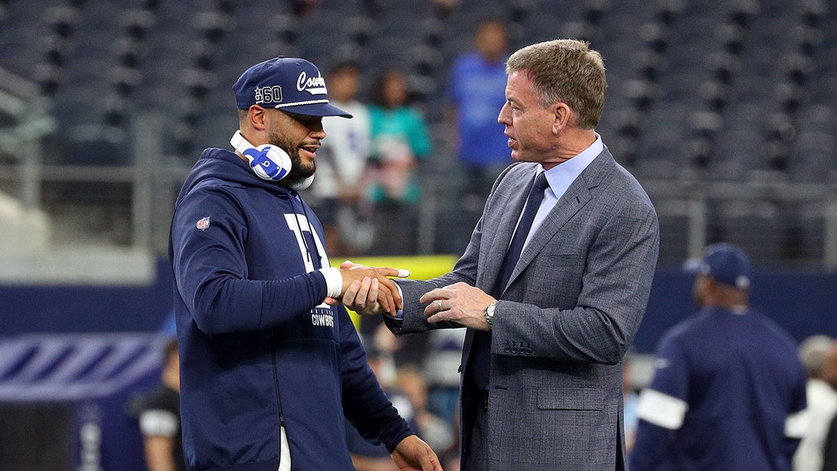 Dak Prescott shakes hands with Troy Aikman