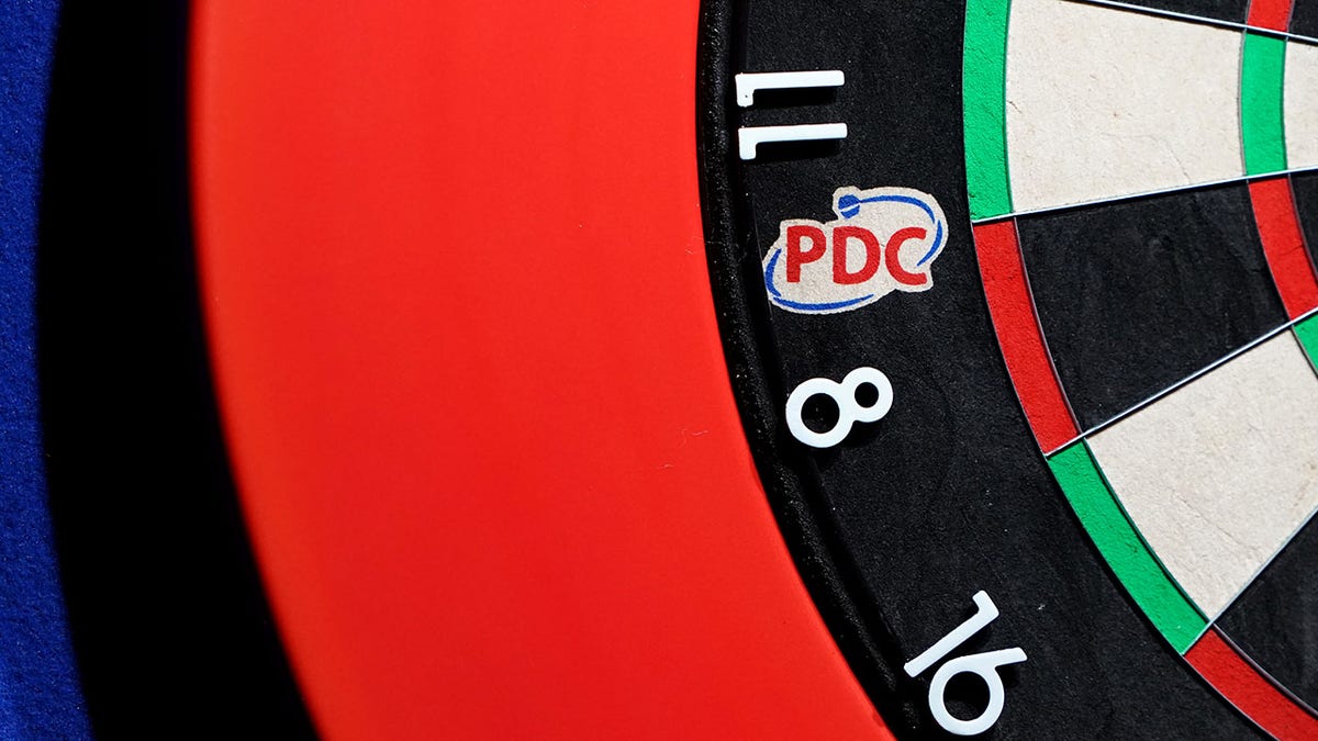 A PDC logo on the dart board