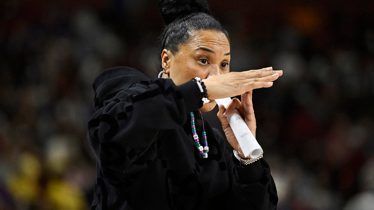 Dawn Staley calls for a timeout.
