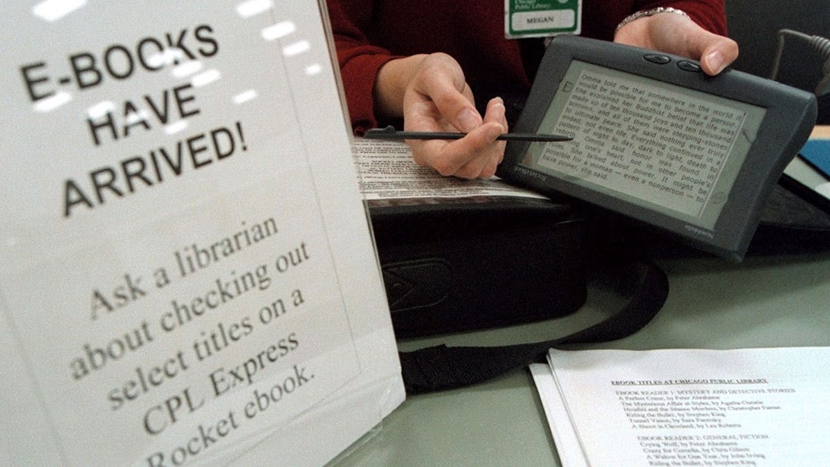 Librarian holding e-book