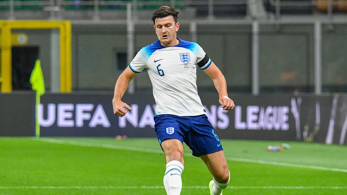 Harry Maguire dribbles soccer ball
