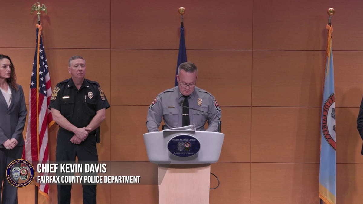 Chief Kevin Davis standing at the podium for press conference