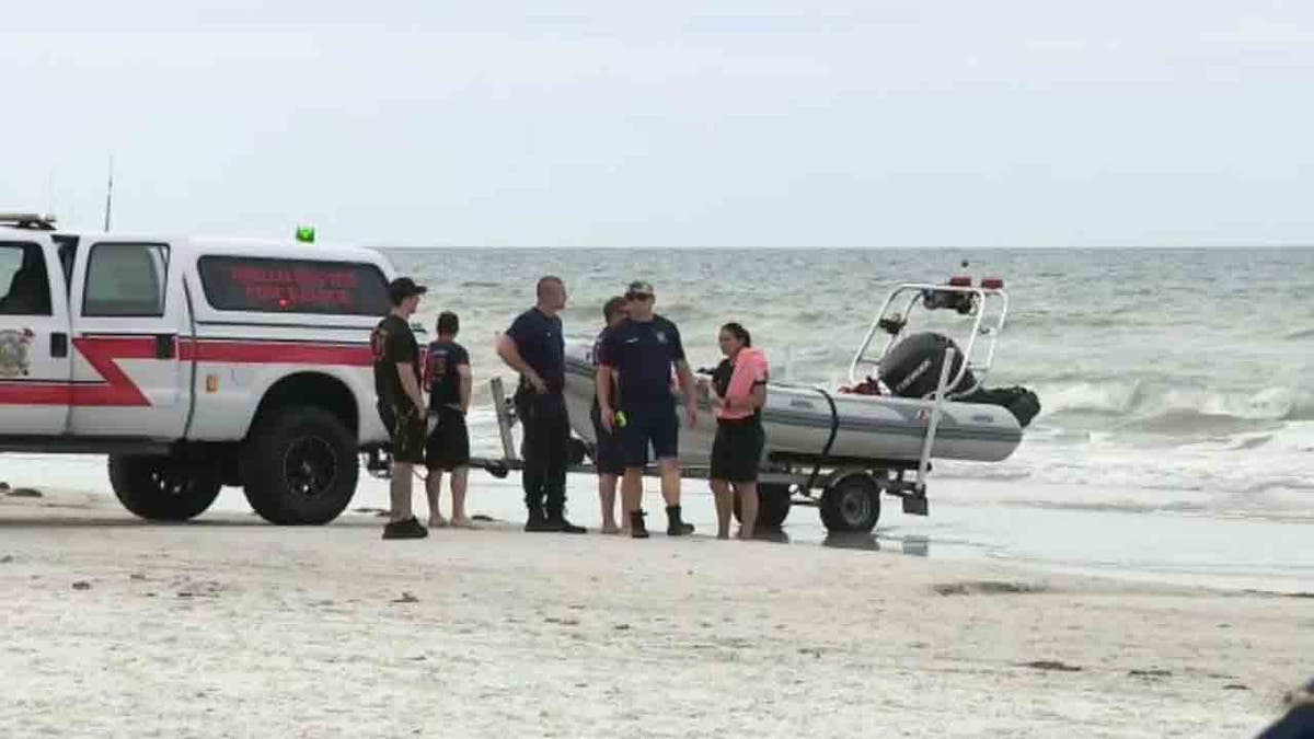 search and rescue team on beach