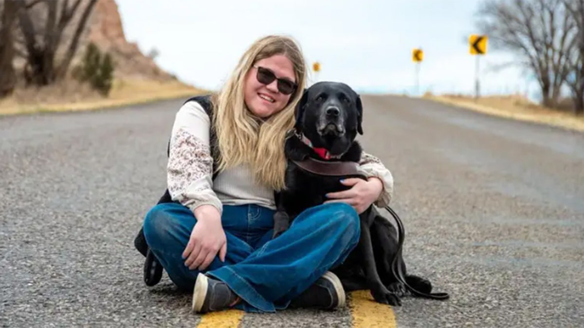 Faith Snapp and guide dog