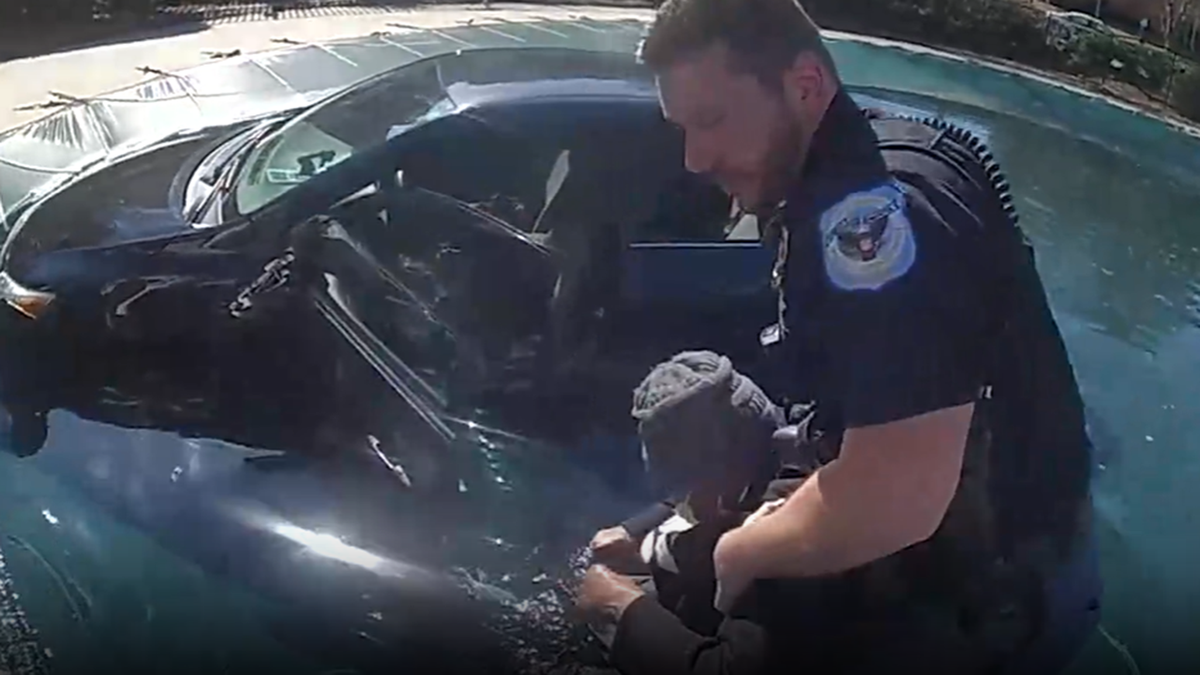 Cobb County police officer rescues woman from crash