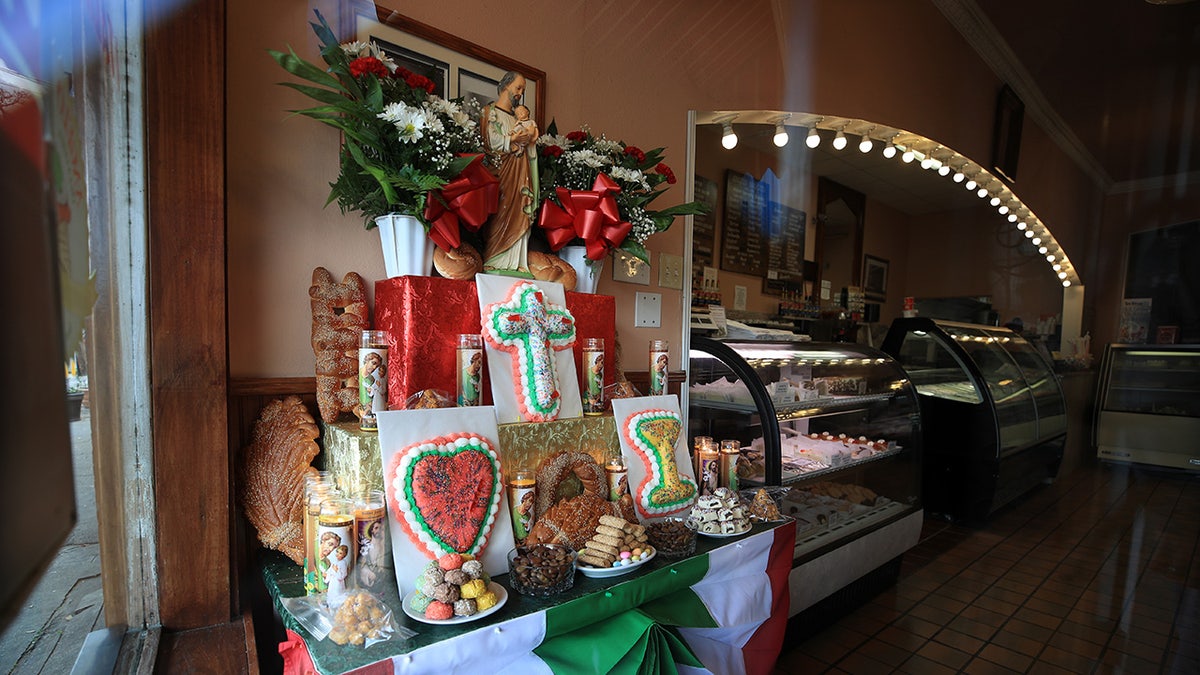 St. Joseph altar with pastries and a statue 