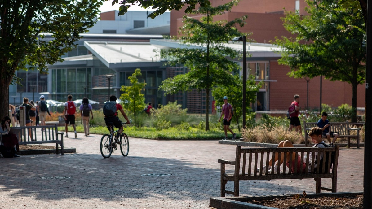 Students walk and bike around NC State's campus in Raleigh