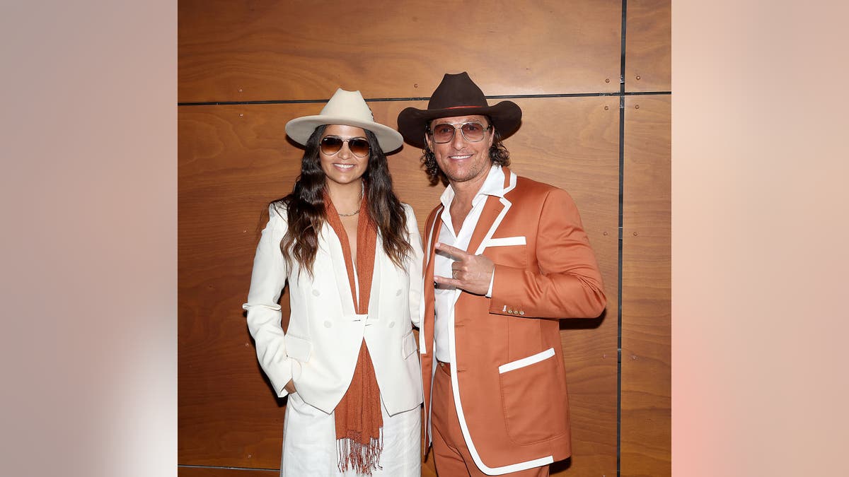 Matthew McConaughey and Camila Alves McConaughey in cowboy hats