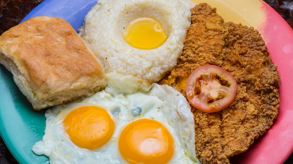 Breakfast of grits, eggs and fried catfish