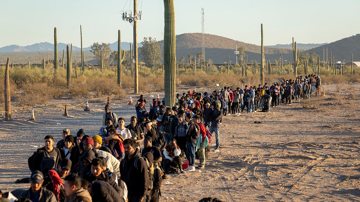 Migrants in a line in desert