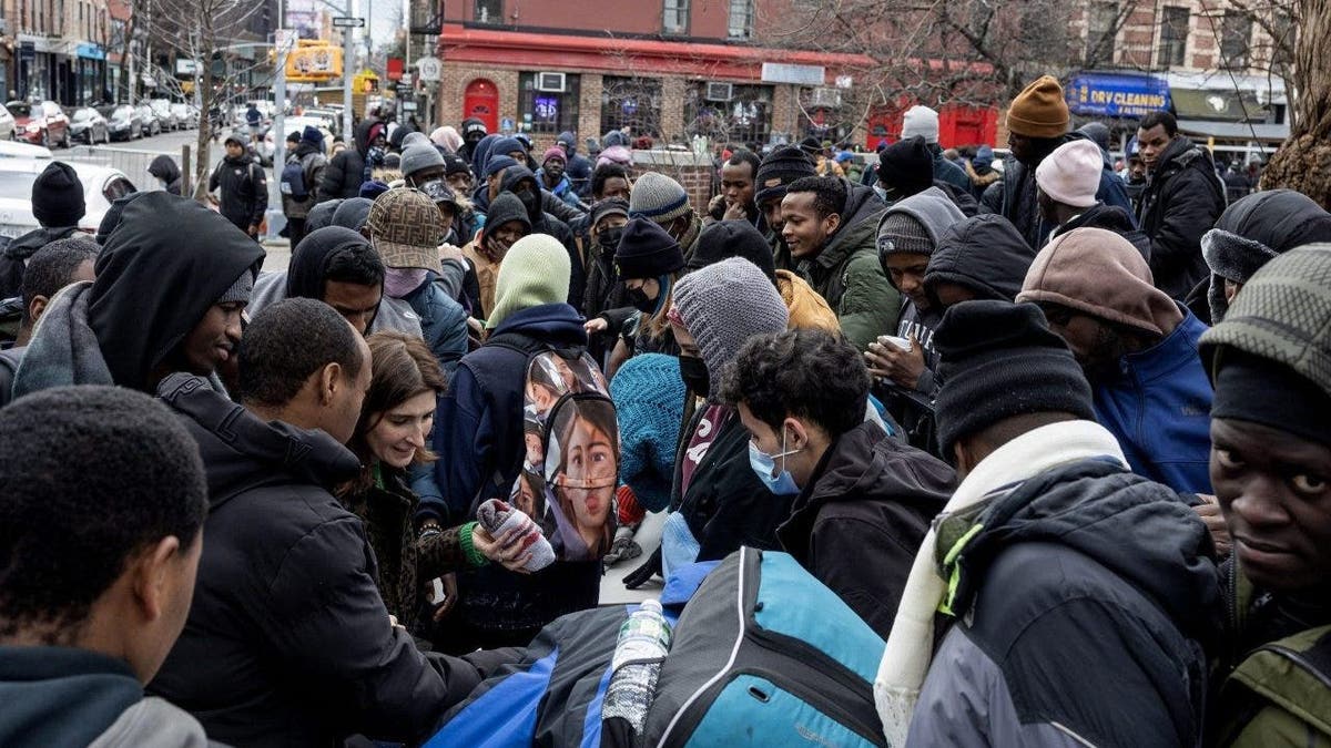 migrants on NYC street corner