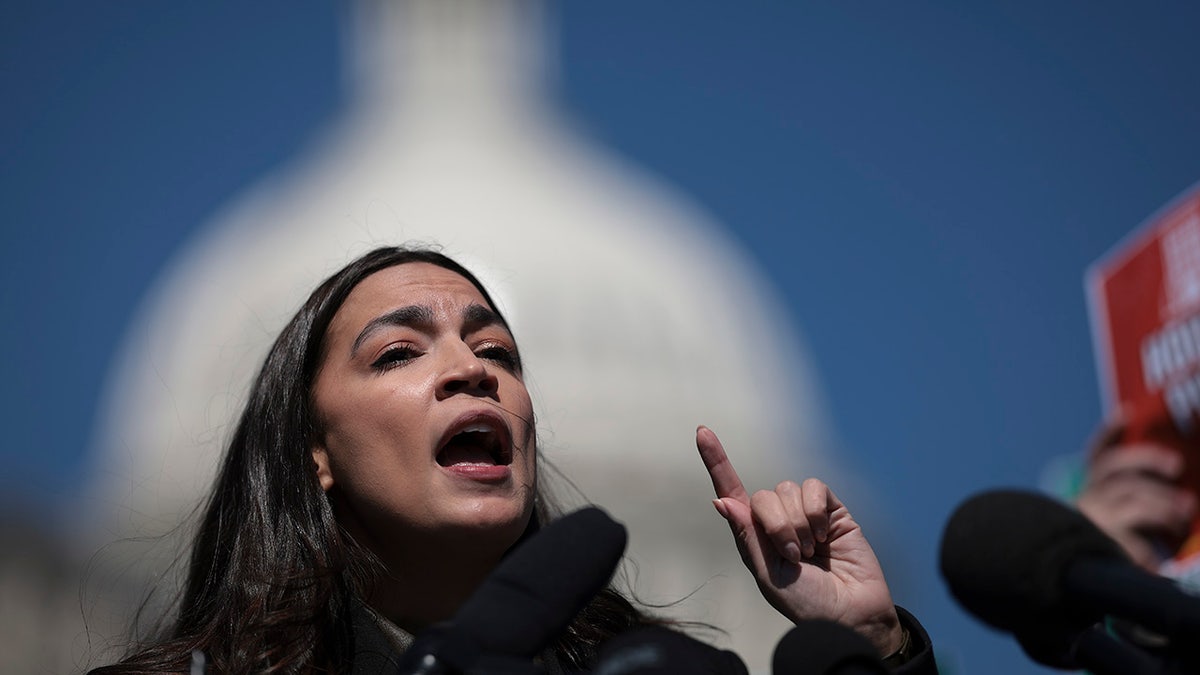 AOC in front of Capitol building
