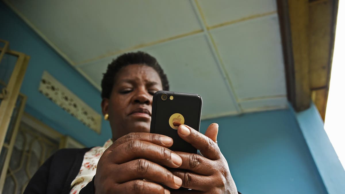 woman looking at her iPhone