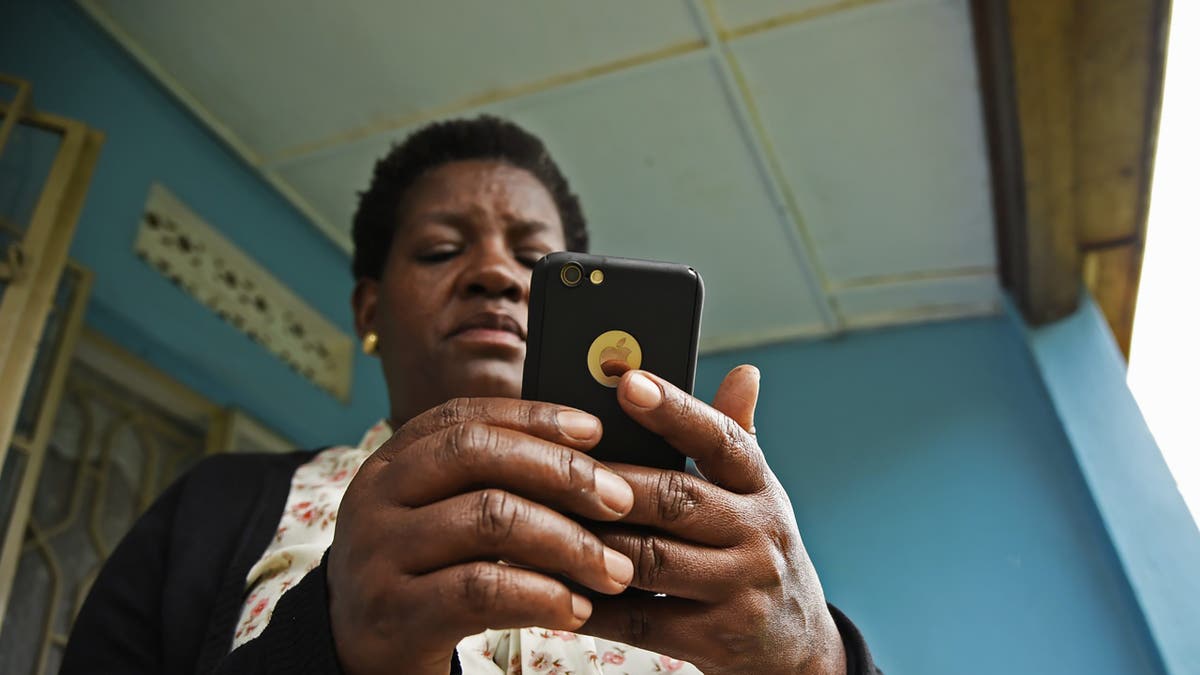 woman looking at her iPhone