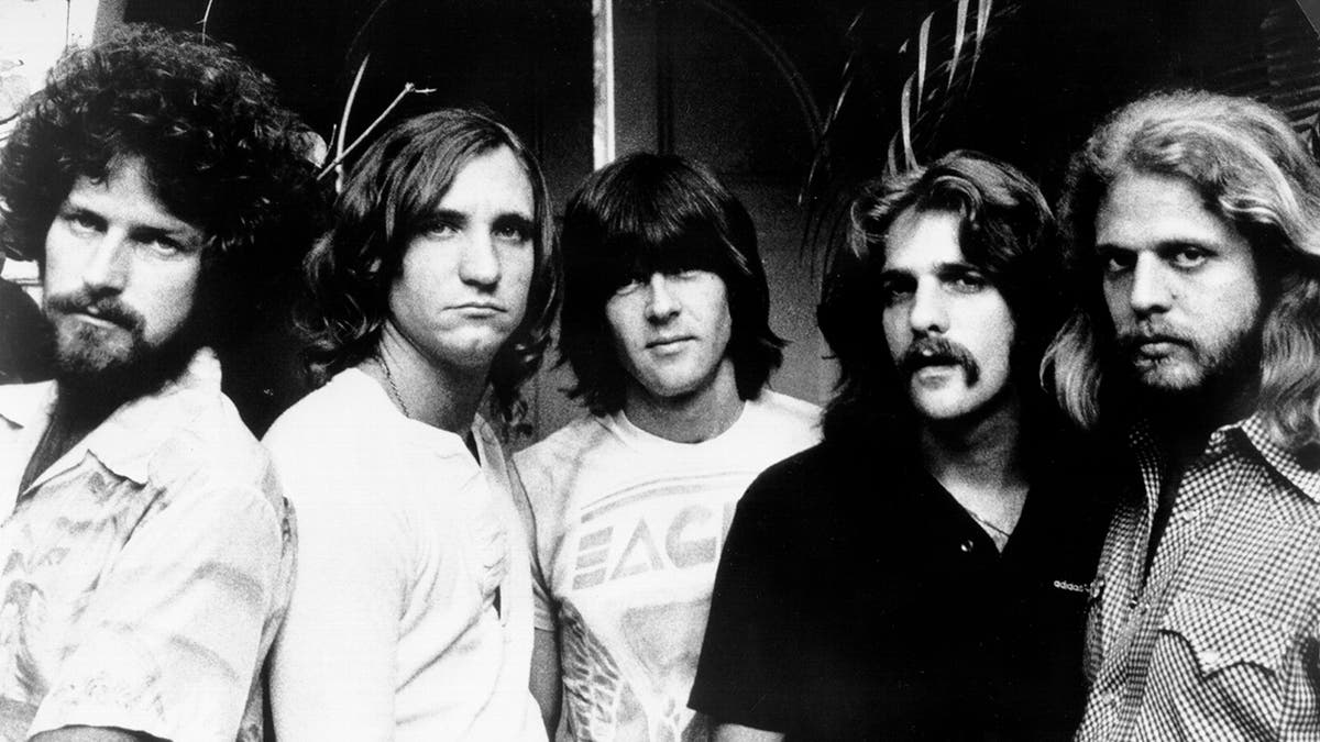 The Eagles posing in a black and white photo