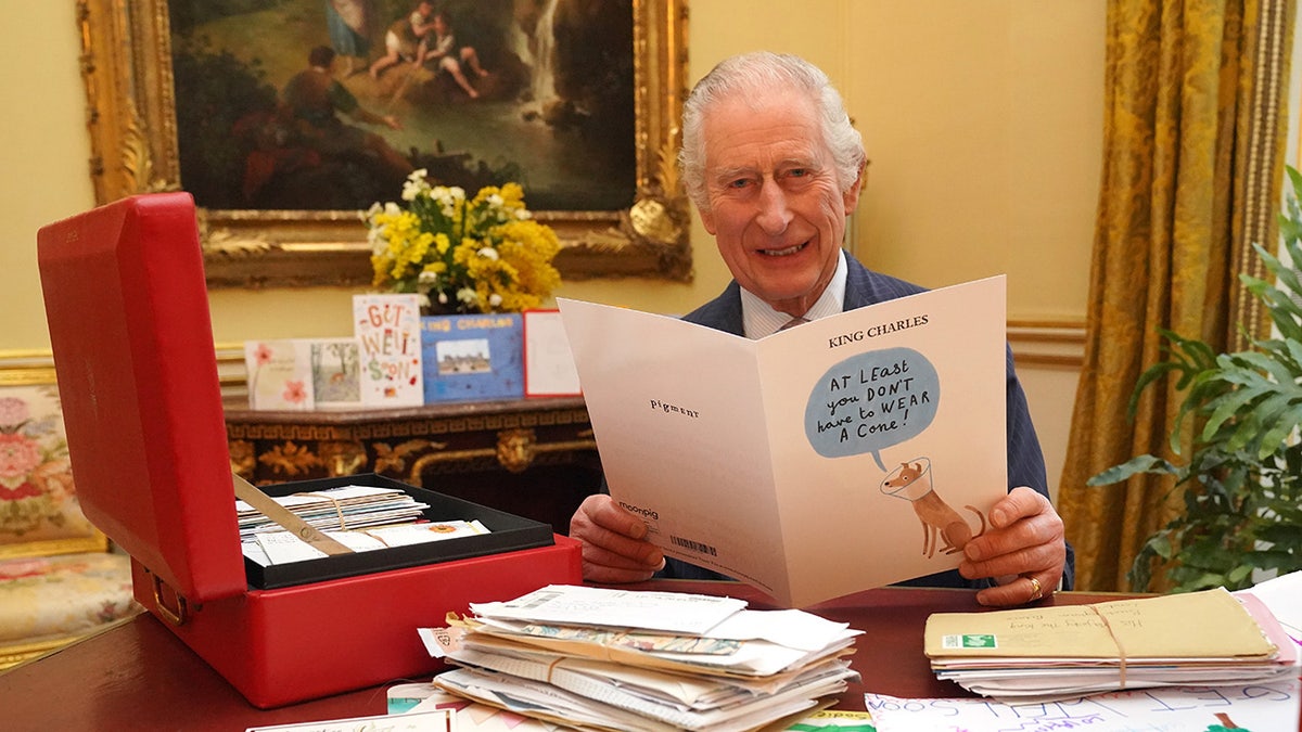 King Charles reading greeting cards