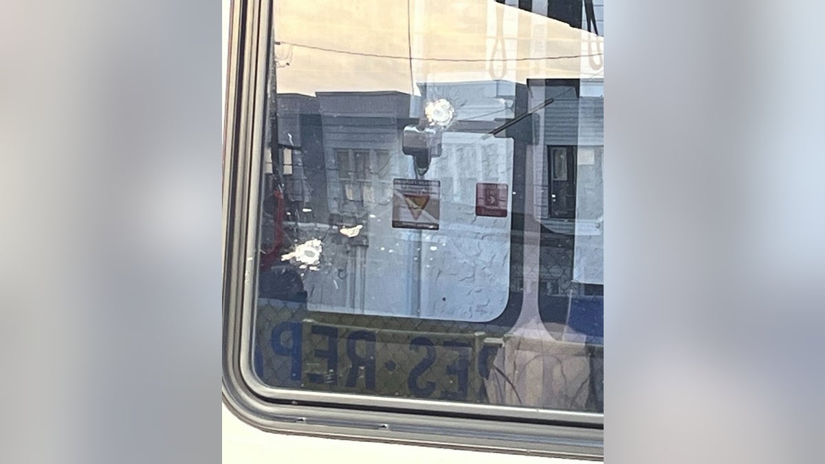 SEPTA BUS WITH A BULLET HOLE IN WINDOW