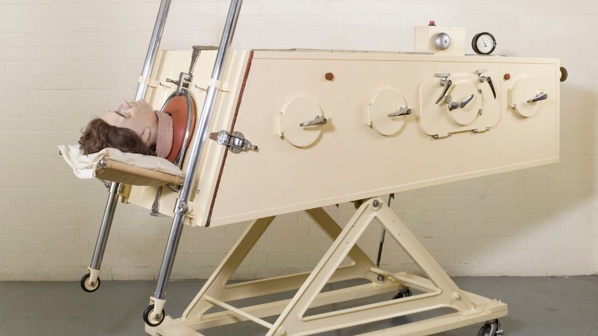 A model inside an iron lung machine