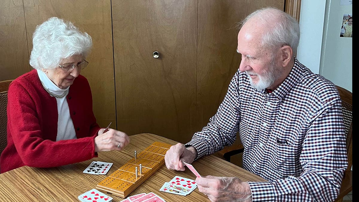 Joanne Blakkan and Bill Hassinger playing cards credit Linda Blakkan