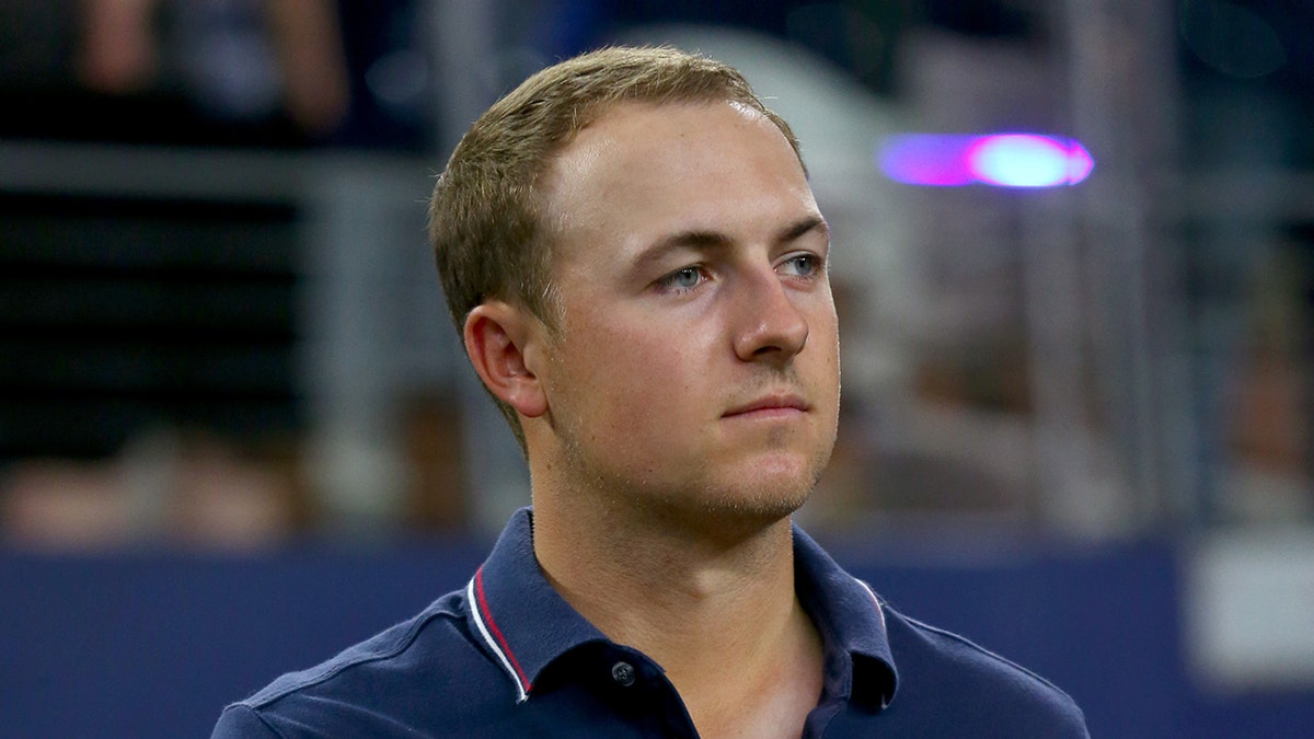 Jordan Spieth looks on field