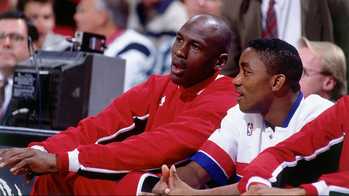 Michael Jordan talks with Isiah Thomas