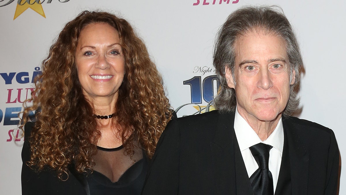 Joyce Lapinsky and Richard Lewis on a red carpet together