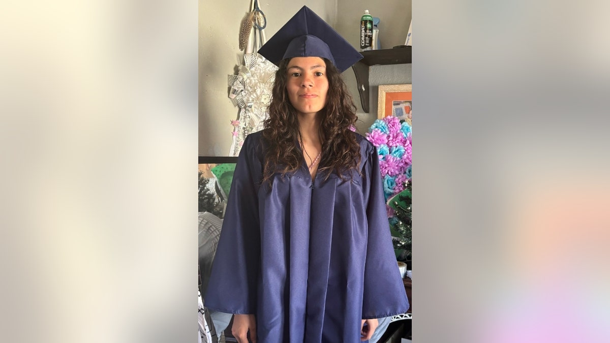 Kaitlin Hernandez wearing a cap and gown