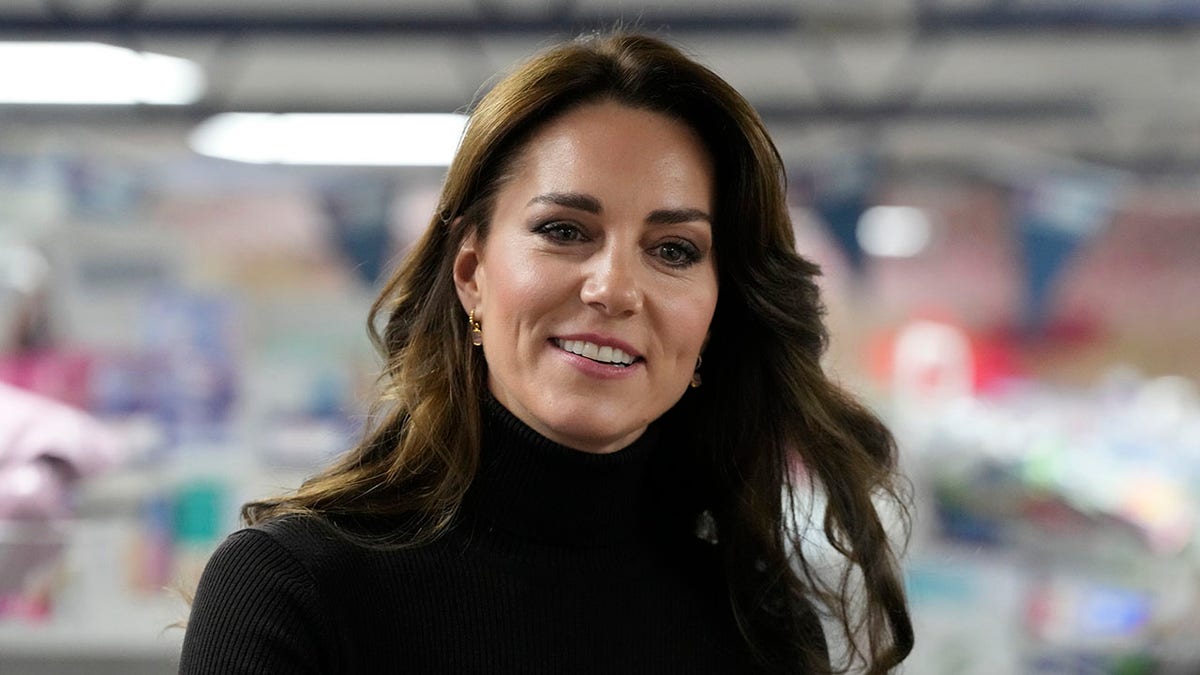 Kate Middleton wearing a black turtleneck