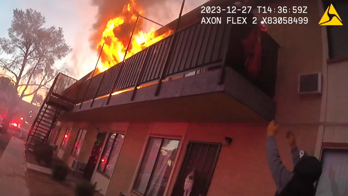 Bodycam footage from Las Vegas police officers show flames shooting from a Reno apartment. A woman was trapped on the balcony. 