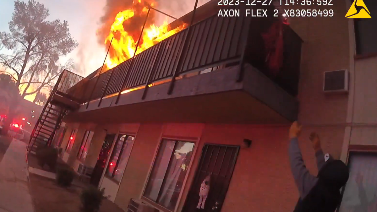 Bodycam footage from Las Vegas police officers show flames shooting from a Reno apartment. A woman was trapped on the balcony. 