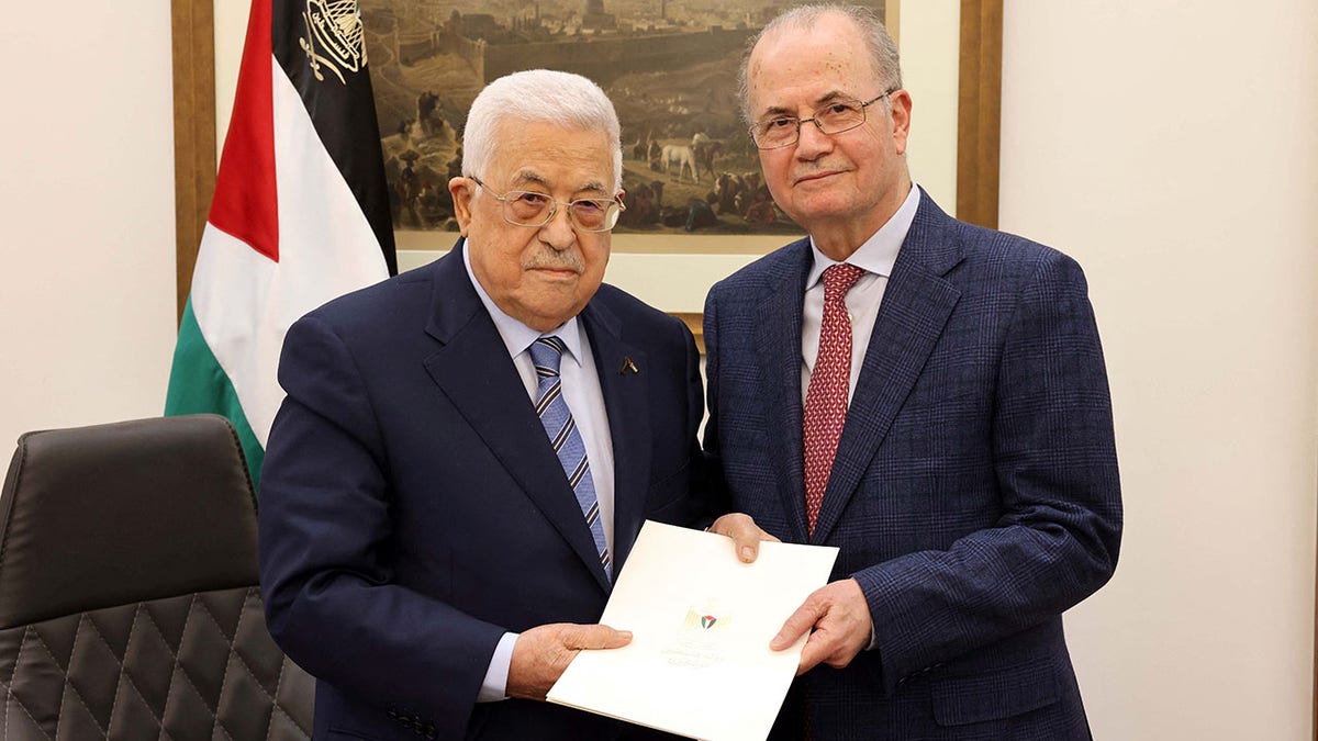 Palestinian President Mahmoud Abbas and Mohammad Mustafa
