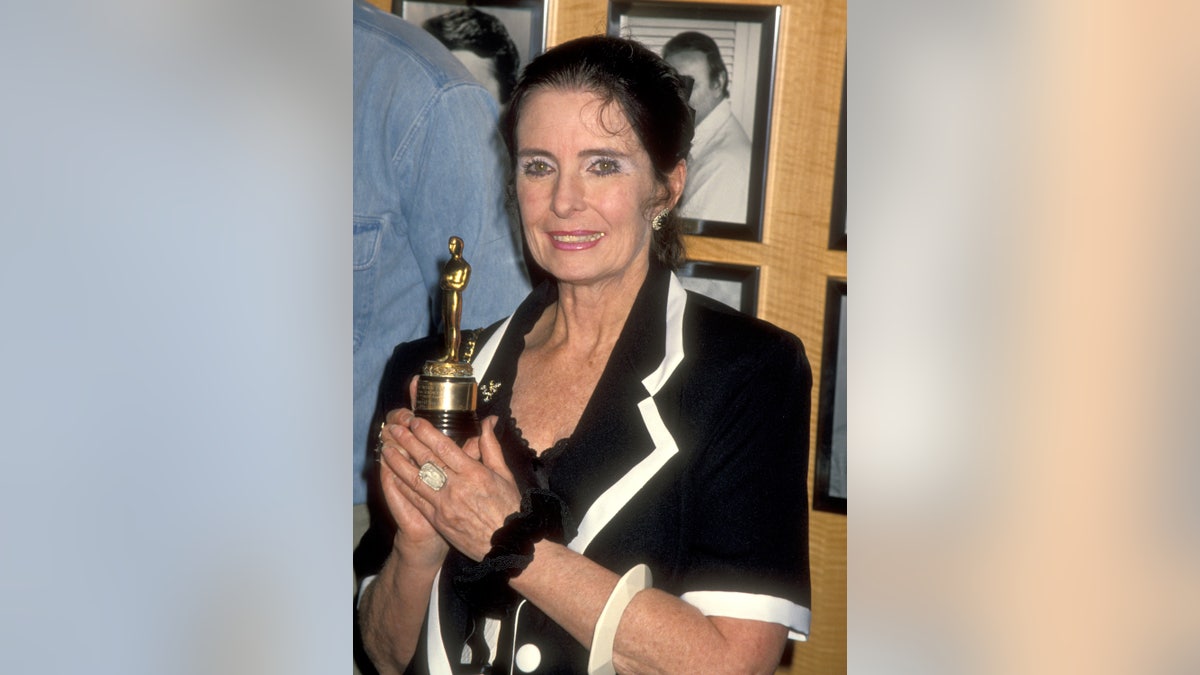 Margaret O'Brien holding her long lost juvenile Oscar