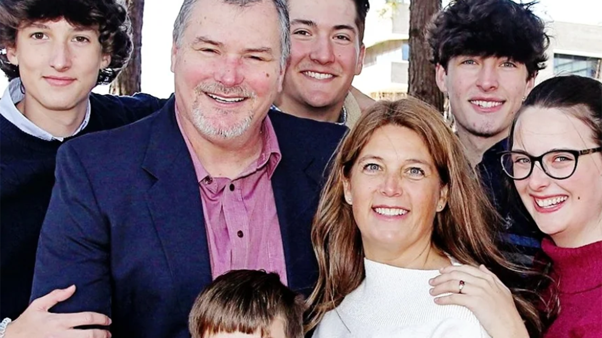 Michele Morrow smiles with her husband and children