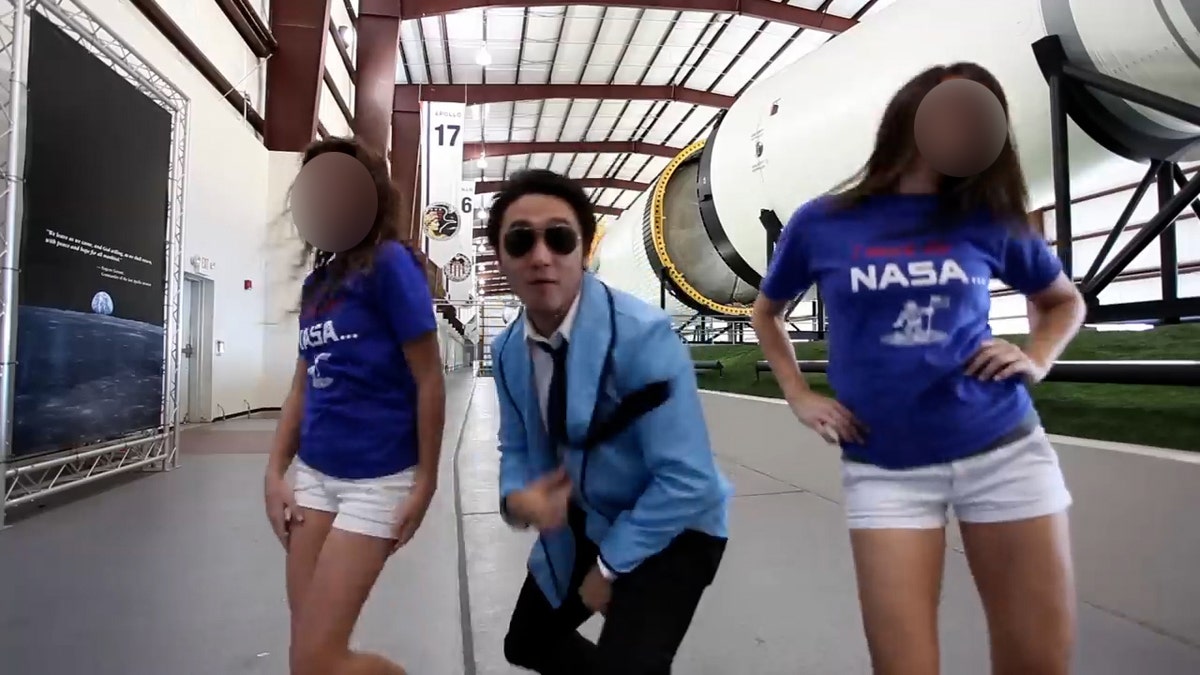 NASA Johnson Style screenshot shows Eric Sim dancing between two women