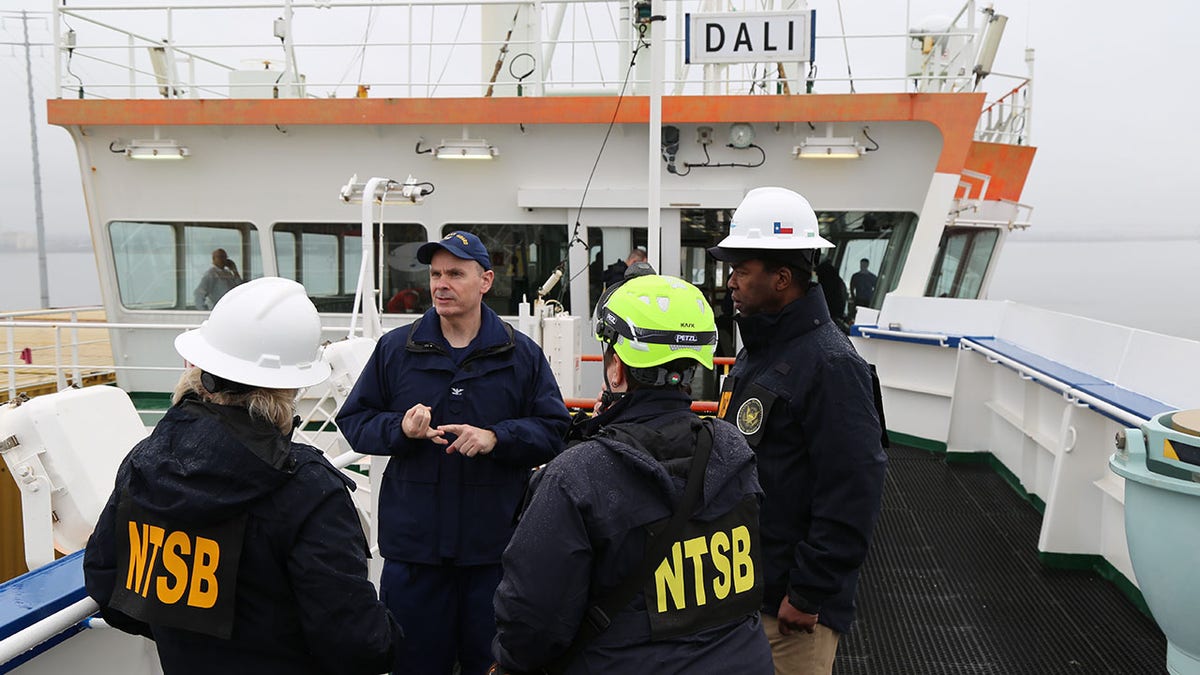 NTSB investigators talking onboard Dali ship