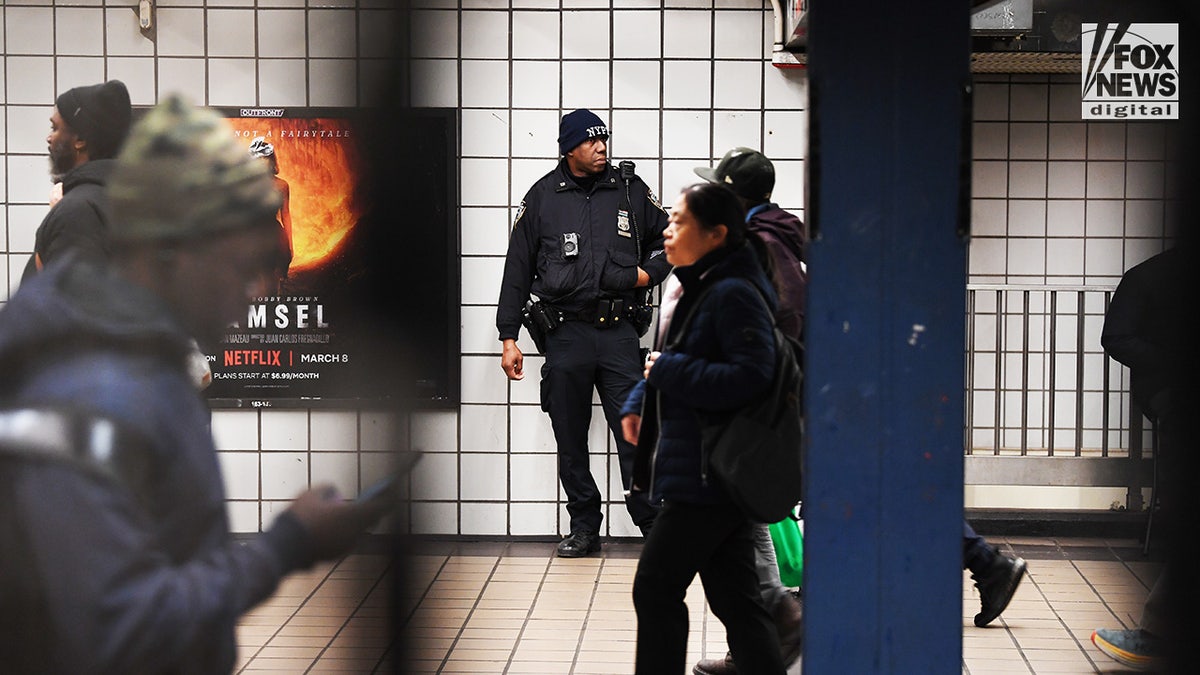 Members of the NYPD and National Guard conduct randomized bag searches in New York City’s subway system