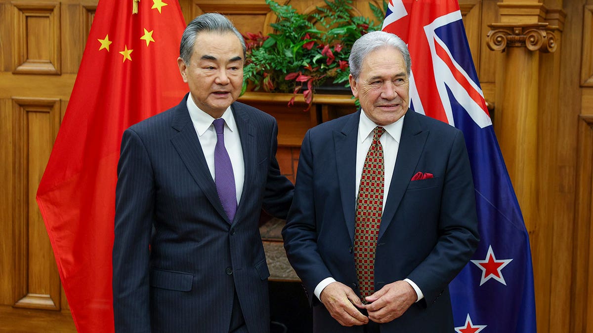 China's Minister of Foreign Affairs Wang Yi, left, meets his New Zealand counterpart Winston Peters