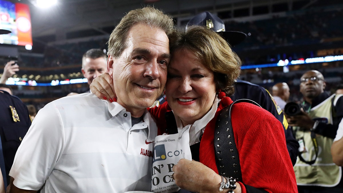 Nick and Terry Saban poses for picture