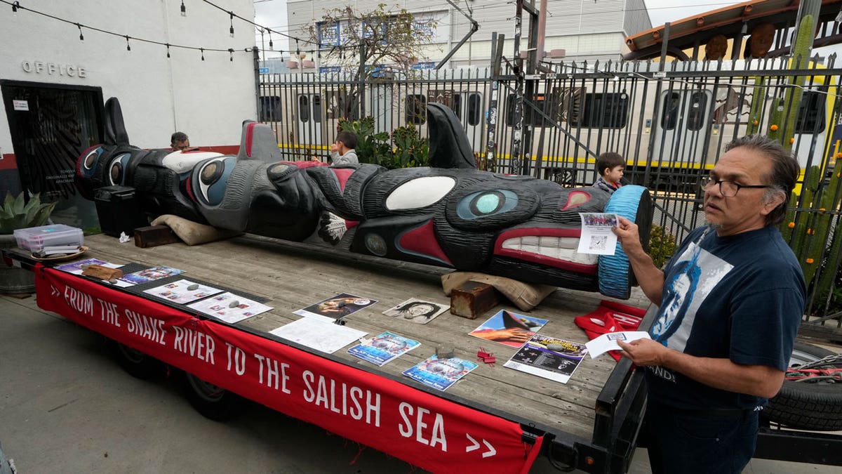 Freddie Lane, a member of the Lummi Nation joins members of the Apache Stronghold group gathered in Los Angeles