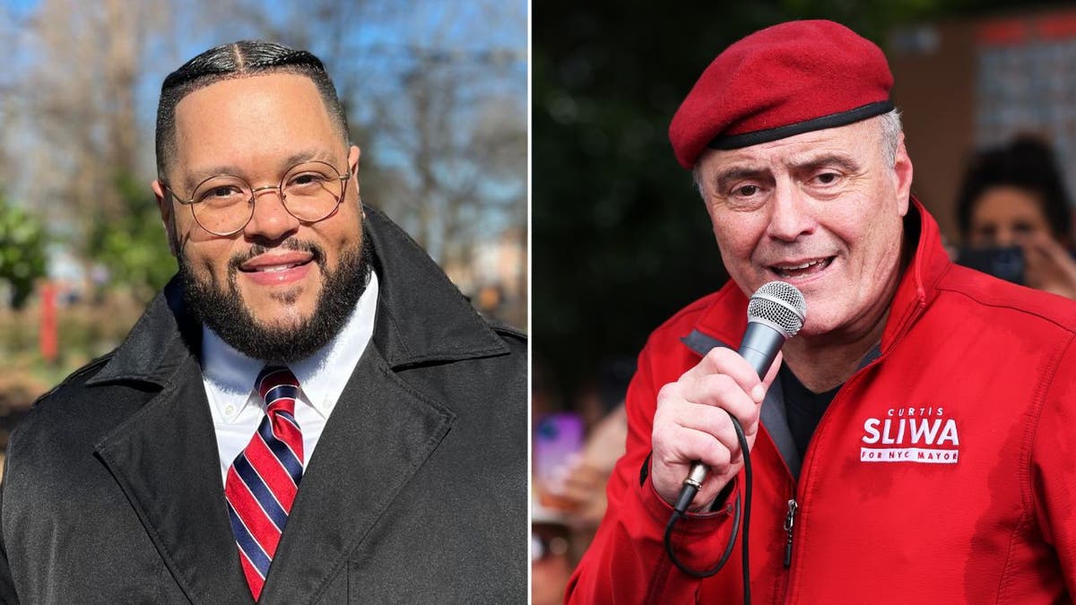 A smiling Ramses Frias and Curtis Sliwa speaking into a microphone