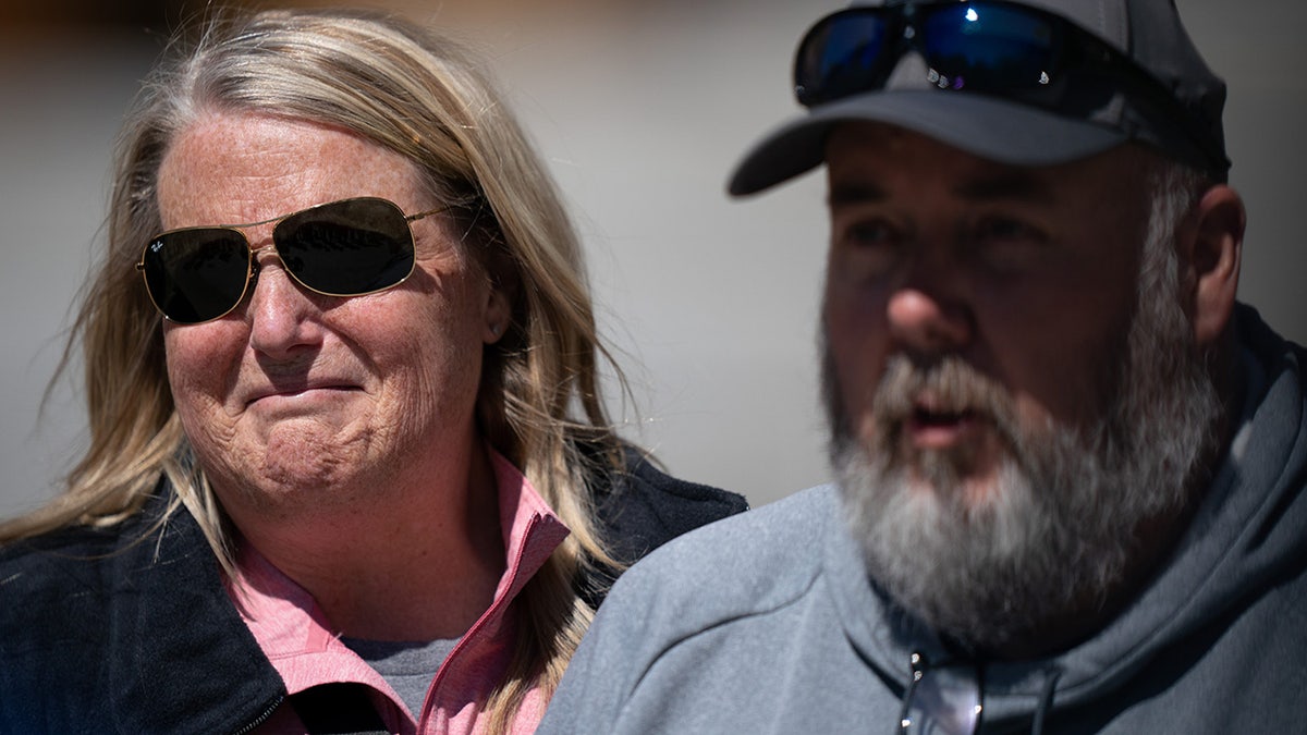 Michelle Strain Whiteid and her husband, Chris Whiteid, speak to the media during a press conference to update the public about the disappearance of University of Missouri student Riley Strain