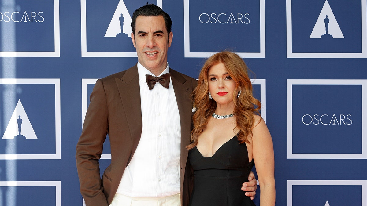 Sacha Baron Cohen and wife Isla Fisher on red carpet