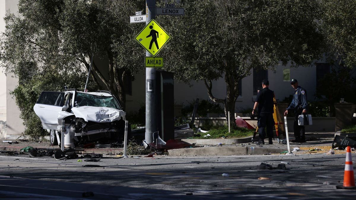 Authorities investigate the scene of an accident in which an SUV crashed into a bus stop on March 16, 2024, in San Francisco.