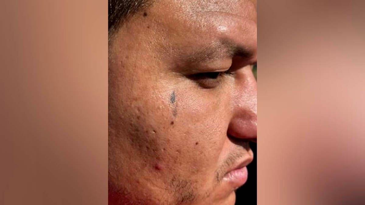 Diego Ibarra's teardrop tattoo that authorities believe to be gang-related.