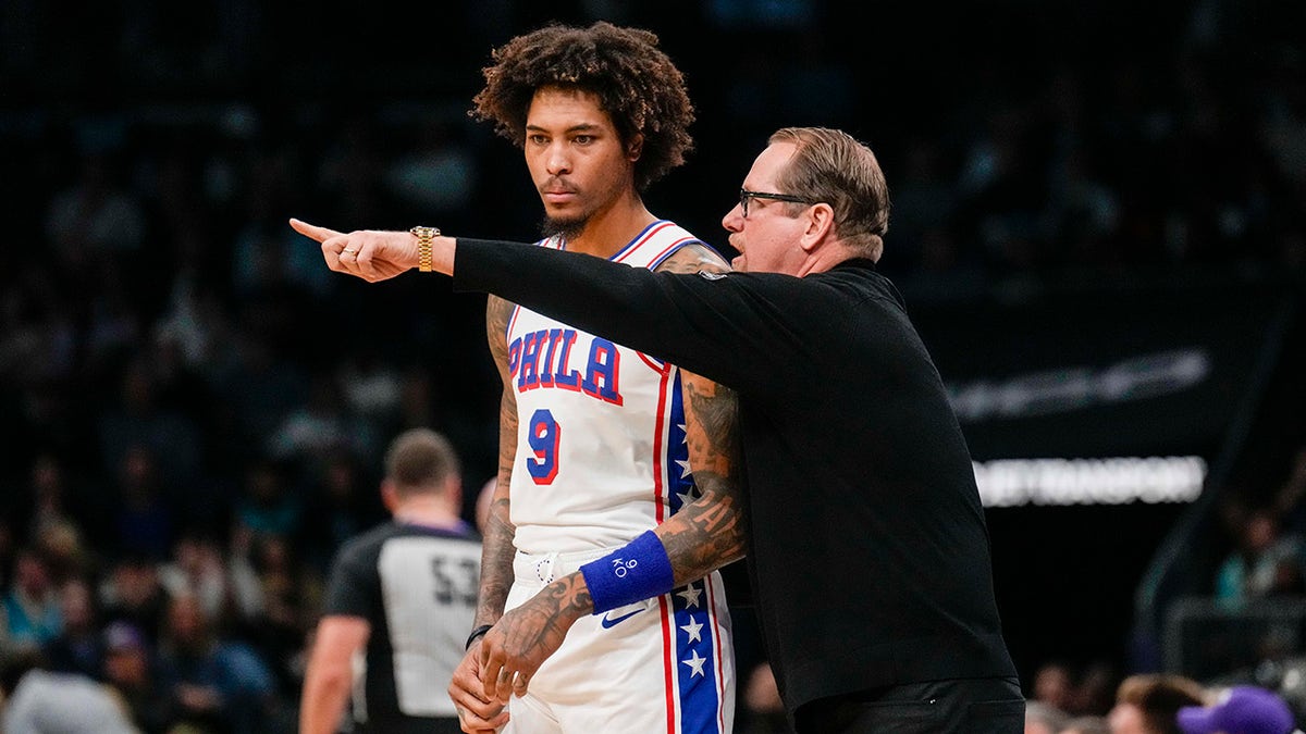 Philadelphia 76ers coach talks to a player