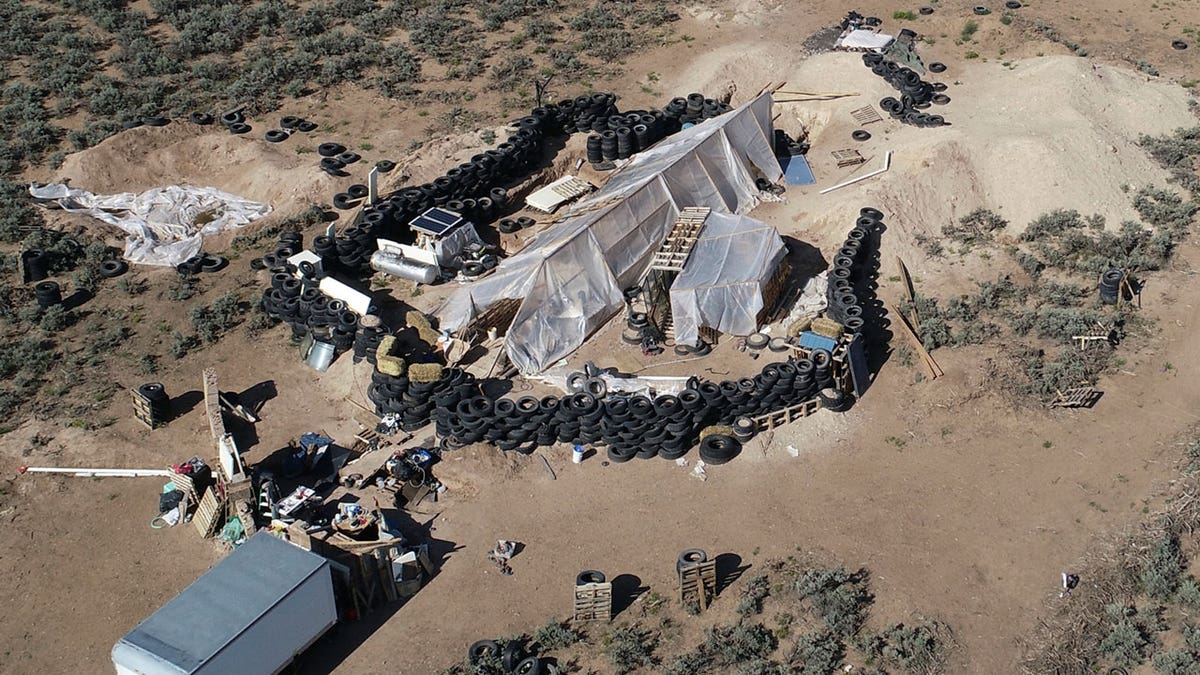 A ramshackle compound in the desert area of Amalia